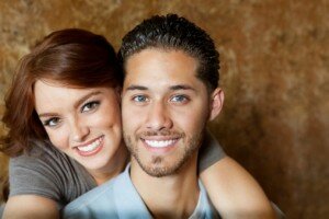 couple smiling with porcelain veneers